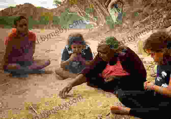 A Desert Indian Woman Sitting On A Rock, Telling A Story To A Group Of Children. Desert Indian Woman: Stories And Dreams