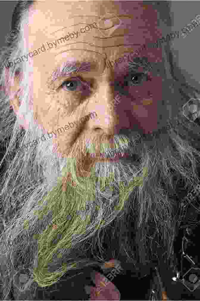 A Portrait Of Harry Bernstein, An Elderly Man With A Long White Beard And A Gentle Smile, Sitting In His Studio Surrounded By His Artwork. The Dream: A Memoir Harry Bernstein