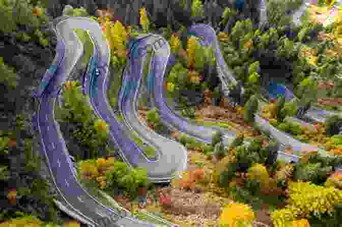 A Winding Road Leading Through A Breathtaking Mountain Pass New Zealand Travel: Land Of The Long Wild Road (Motorcycle Adventure Travel 1)