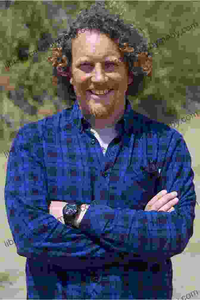 An Image Of Martin Dorey Posing With A Sign That Reads 'England To New Zealand The Hard Way' Just Sea And Sky: England To New Zealand The Hard Way