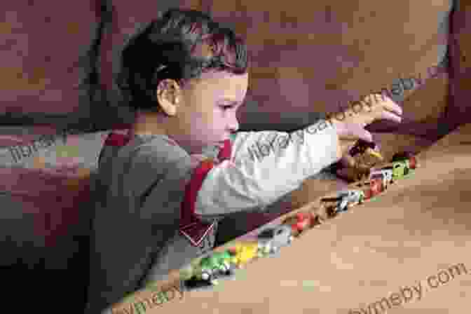 Child With Autism Engaging In Repetitive Play With Toy Cars The Autism Discussion Page On The Core Challenges Of Autism: A Toolbox For Helping Children With Autism Feel Safe Accepted And Competent