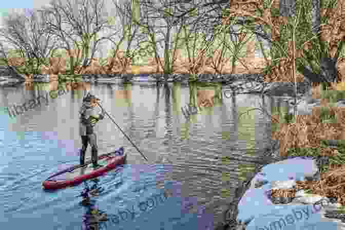 Paddler Carrying A Kayak Through A Shallow Stream Paddling Pennsylvania: A Guide To 50 Of The State S Greatest Paddling Adventures (Paddling Series)